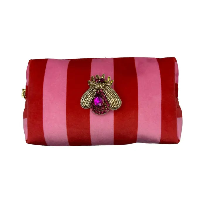 Trousse de maquillage rayée et broche