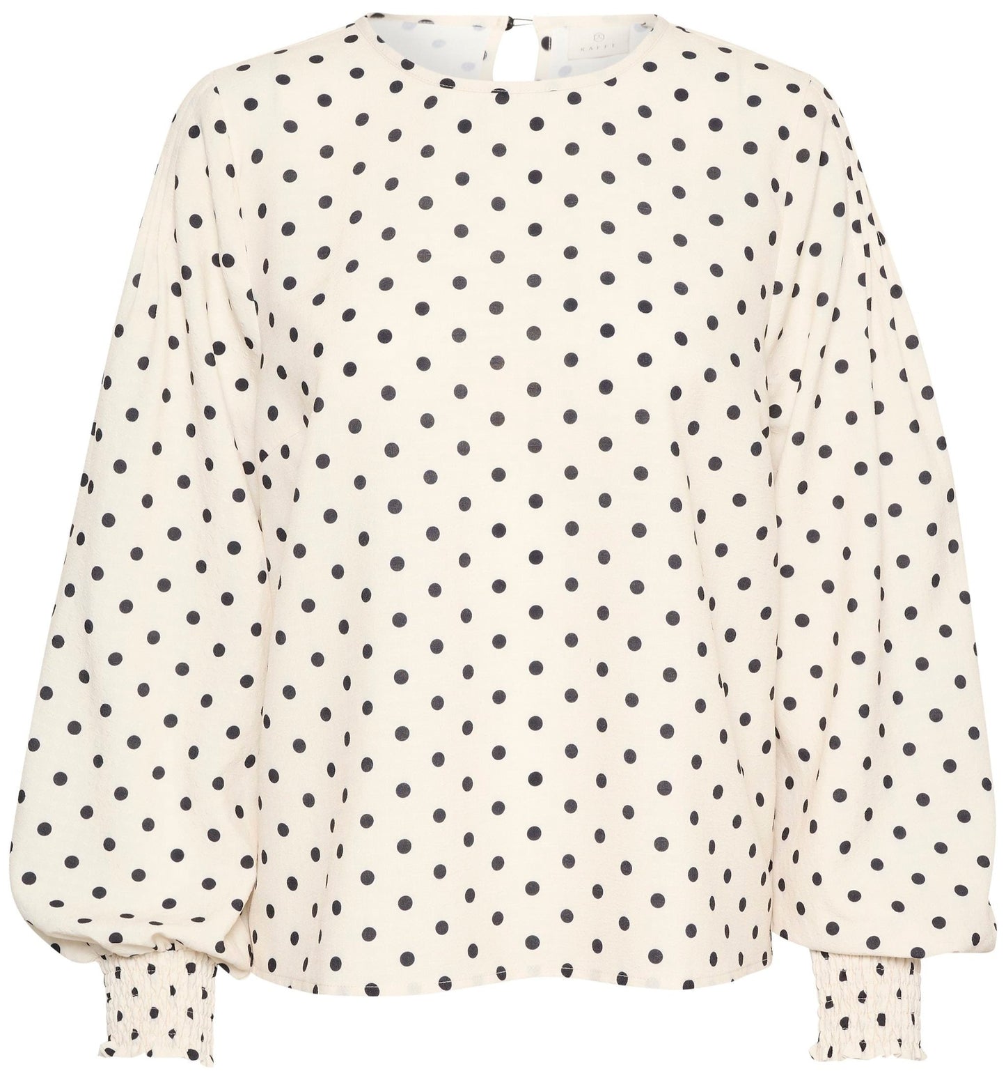 Blouse blanche à pois noirs