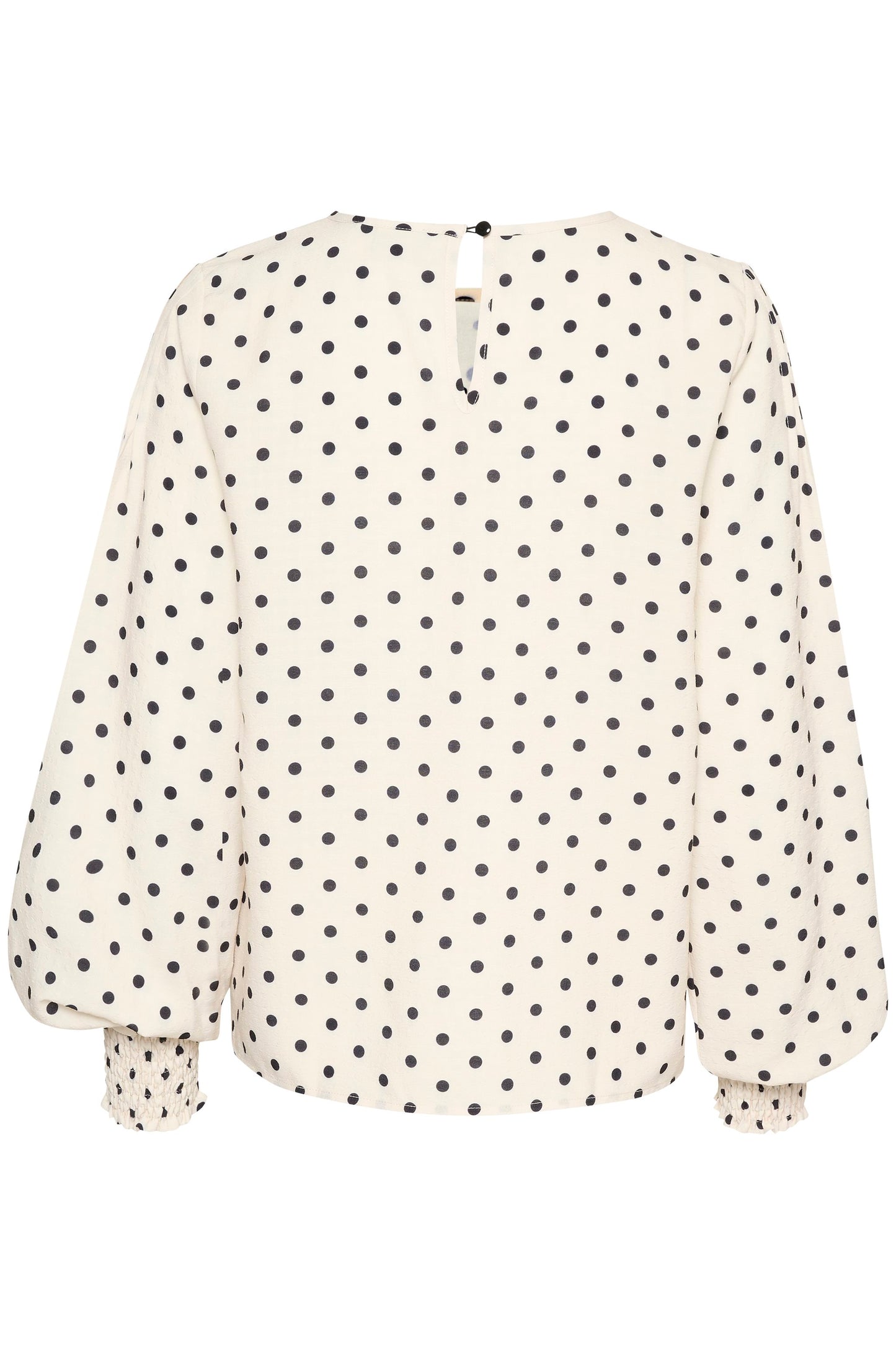 Blouse blanche à pois noirs